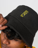 Black Bucket Hat with Yellow BSPKN. Print
